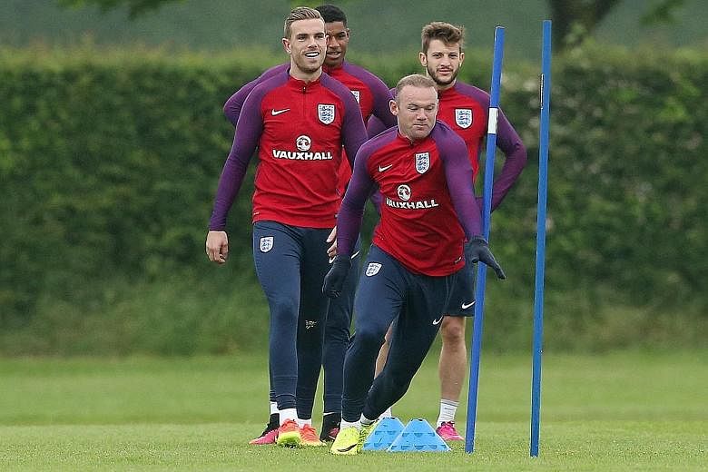 England skipper Wayne Rooney leading the players through their training drills. Their manager Roy Hodgson has picked five natural centre-forwards in his Euro 2016 squad and may look to test his attacking options when they face Portugal at Wembley in 