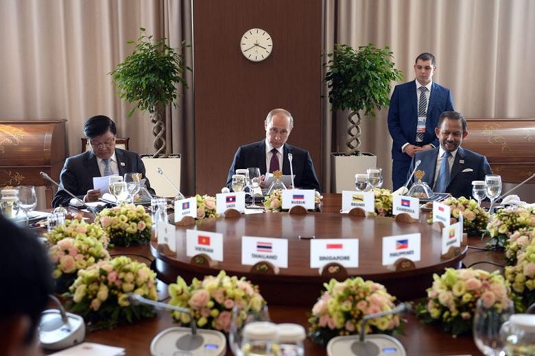 Mr Putin (centre) at a working breakfast with leaders attending the Asean-Russia Summit in Sochi. Seated beside him are Prime Minister of Laos Thongloun Sisoulith (left) and Sultan Haji Hassanal Bolkiah of Brunei.