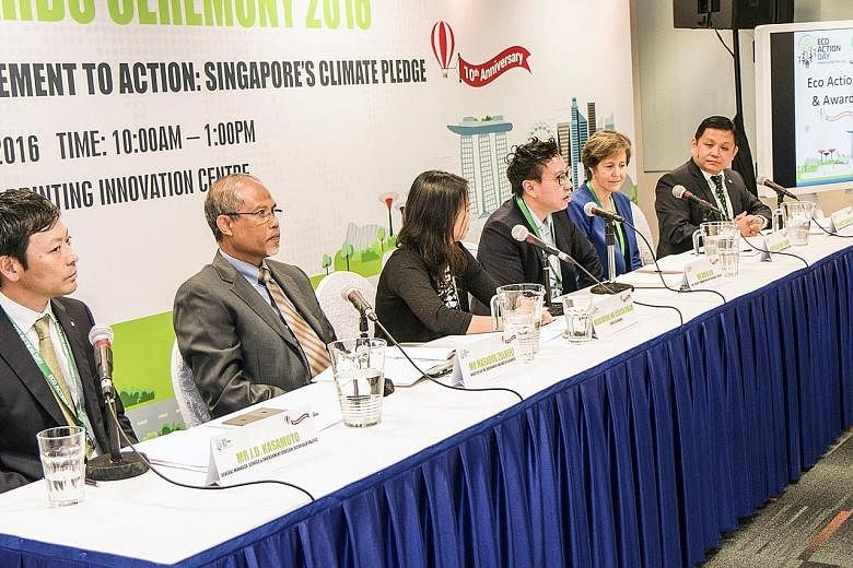 The panel yesterday included (from left) general manager of Ricoh's service and environment division J.D. Kasamoto; Minister Masagos Zulkifli; Eco-Business editor Jessica Cheam; vice-president of communications and sustainability at Unilever David Ki