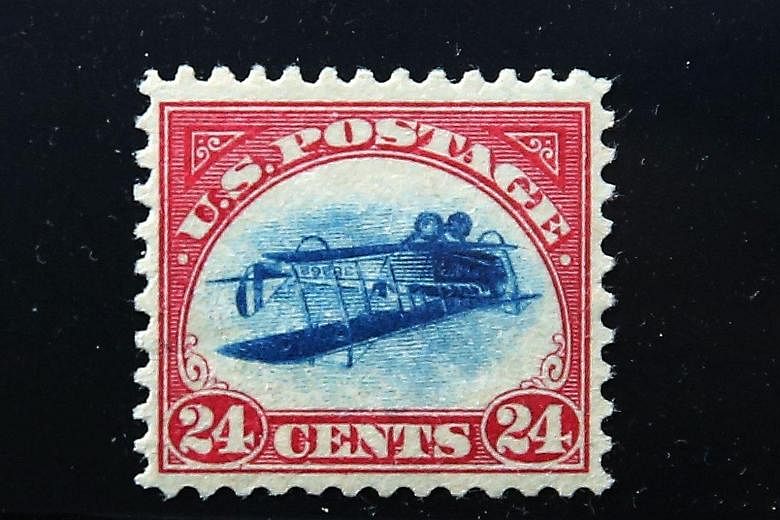 A rare stamp, known as an "Inverted Jenny", on display on Thursday at the World Stamp Show in Manhattan, New York City. The stamp, one of the most famous in American history, was stolen from a display case at a convention in 1955 and was located only