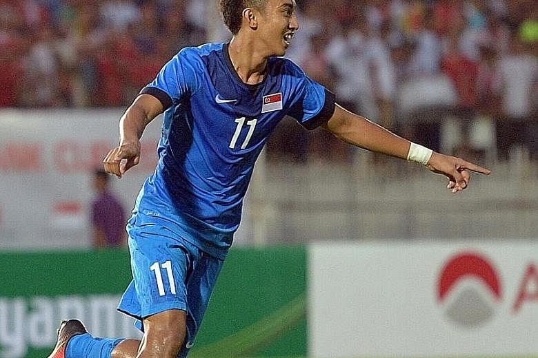 Singapore midfielder Faris Ramli celebrates his 34th-minute goal in Yangon. He latched on to a through ball from defender Baihakki Khaizan, finishing off a counter- attacking move.