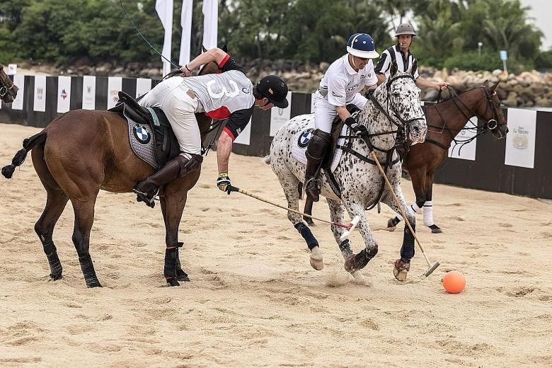 Players going head to head on Sentosa's Tanjong Beach, as part of an exhibition match for the BMW Singapore Beach Polo Championship today and tomorrow. The smaller field and soft surface make the sport tougher than the regular game.