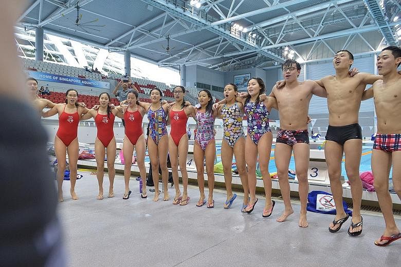 Swimmers doing a cheer at the end of training at the OCBC Aquatic Centre. They were participating in a junior swimming development camp. Club coaches were also part of the four-day event.