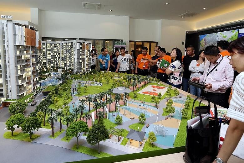 Potential buyers checking out a model of Parc Life EC in Sembawang in April. ECs are popular as they offer facilities similar to those in condominiums but at a lower price. However, there are rules for buyers and a key step is to check for eligibilit