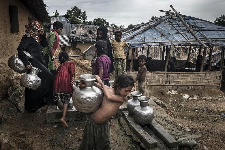 Rohingya refugees at a camp in Teknaaf, Bangladesh, in June last year. Thousands more live in makeshift camps. They are vulnerable to human traffickers and exploited as cheap labour.