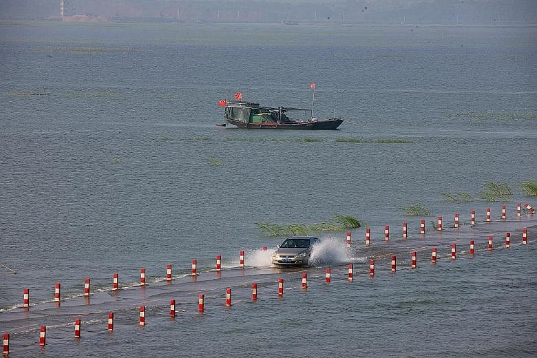 The "most beautiful water highway" across Poyang Lake, China's largest freshwater lake, in Jiangxi province lies flooded following continuous rain. Hundreds of thousands of people across China have been affected by heavy rains and flooding, and more 