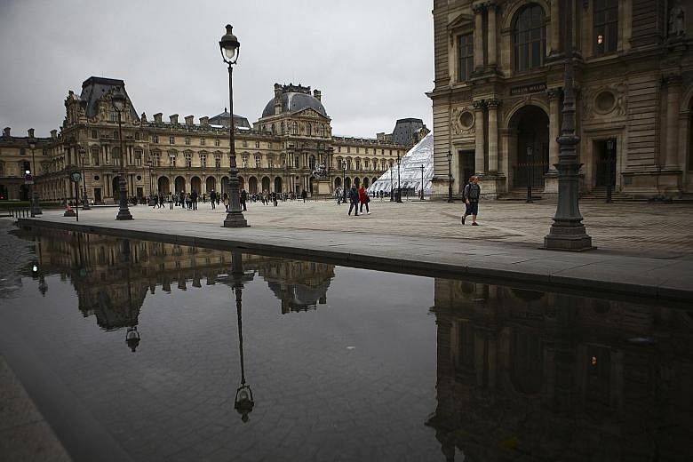 Flooding outside the Louvre Museum in Paris. The Louvre Museum relocated masterpieces from rooms vulnerable to flooding.