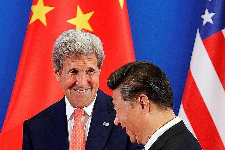 Chinese President Xi Jinping with US Secretary of State John Kerry at the US-China Strategic and Economic Dialogue in Beijing yesterday. Noting that both countries share "extensive mutual interests", Mr Xi stressed the need to avoid a confrontational