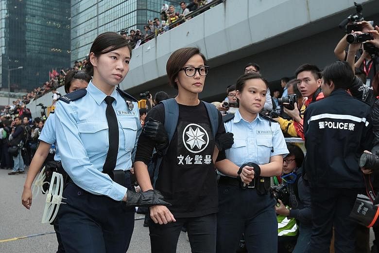 Singer Denise Ho being arrested in December 2014 for taking part in the pro-democracy Occupy Central movement in Hong Kong. On Sunday, Lancome abruptly cancelled a publicity event in Hong Kong at which she was to have performed.