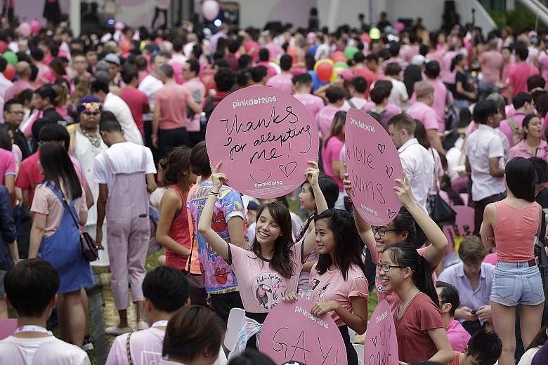 Participants during last Saturday's annual Pink Dot event at Speakers' Corner. This year's corporate sponsors included multinationals like Google as well as banks such as JP Morgan and Goldman Sachs.