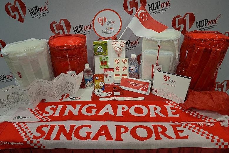 One of the highlights of the NDP 2016 funpack (above), which features 18 items, is an LED wristband (left) that is wirelessly programmed to blink in tandem with the show's lights and sounds. The goodie bag is made of translucent plastic for the first