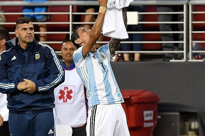 Angel di Maria paying tribute to his late grandmother after scoring Argentina's opening goal against Chile in their Copa America Centenario match in Santa Clara. The win avenged his team's penalty shoot-out loss to their rivals in last year's Copa fi