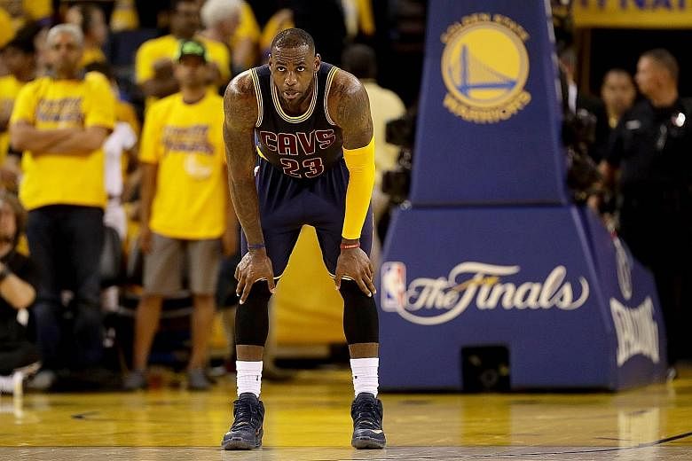 A dejected LeBron James during Game 2 of the NBA Finals, where he top-scored for the Cavaliers with just 19 points but gave the ball away seven times.