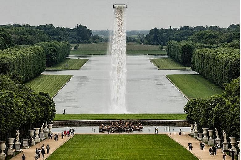 The installation cascades into the Grand Canal of the Gardens of Versailles.