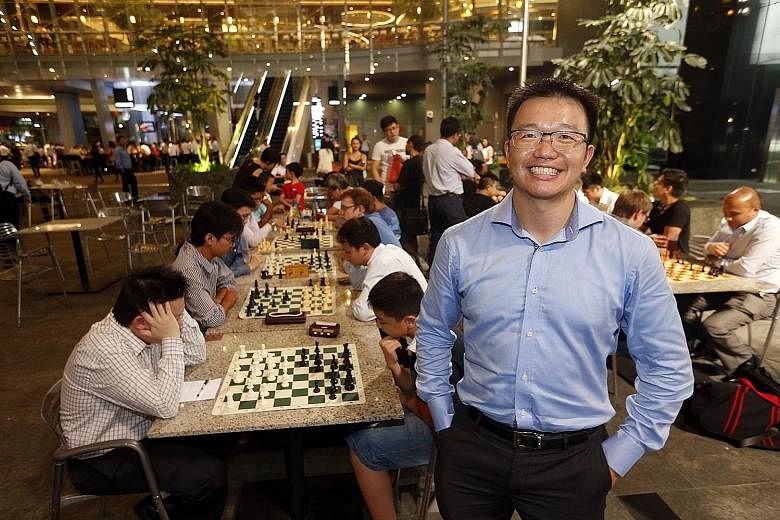 Mr Loh at The Cube in Asia Square Tower 1, where players of his after-work chess community battle it out every Wednesday.