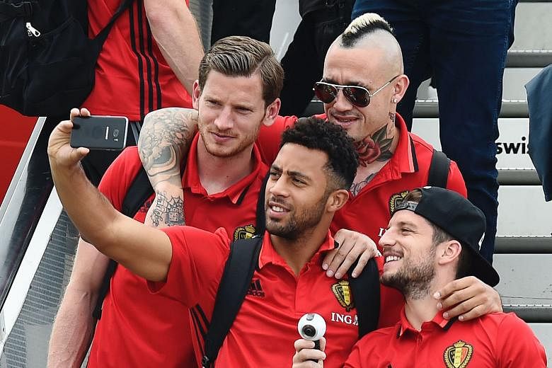 Clockwise from left: Belgium's Jan Vertonghen, Radja Nainggolan, Dries Mertens and Mousa Dembele announcing their departure for Bordeaux, France on social media. The Red Devils, and coach Marc Wilmots, face high expectations to live up to their lofty Fifa
