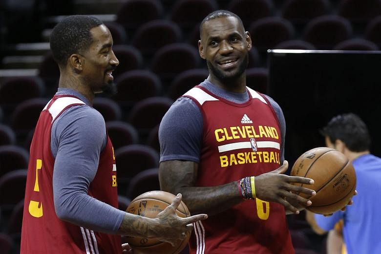 Cleveland Cavaliers' LeBron James (right) and J.R. Smith practise at the Quicken Loans Arena in Cleveland ahead of Game 3 of their NBA Finals series with the Golden State Warriors. The Cavaliers will hope playing at their home court will prove an advantag