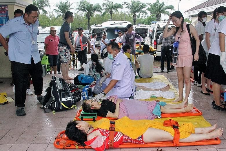 Thai medics attending to tourists after a speedboat crash. Despite MFA warnings about terrorism and accidents in Thailand, many Singaporeans have not been deterred from holidaying there, especially during the current school holidays.
