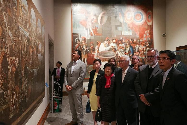 President Tony Tan Keng Yam (third from right) and his wife Mary Tan visiting Chapultepec Castle, now the National History Museum, in Mexico yesterday. They were hosted by museum director Salvador Rueda Smithers (second from right). With them are (fr