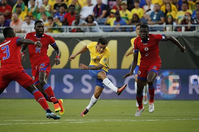 Brazil midfielder Philippe Coutinho (centre) opening the floodgates with his first goal during the 7-1 thrashing of Haiti in Group B of the Copa America Centenario.