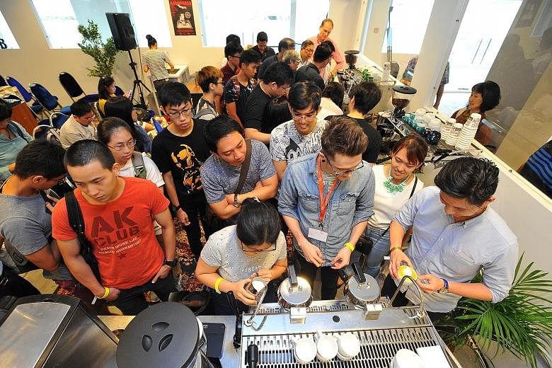 Five Senses Coffee's Mr Jacob Ibarra holding the crowd's attention during a workshop at the Singapore Coffee Festival, which drew over 4,000 visitors yesterday.