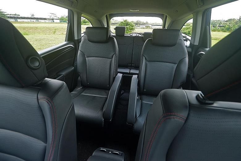 The six-seater Honda Jade (left) has a cosy cabin with premium fit and finish (right) and a third row (above) that can be flipped down to transport bulky items.