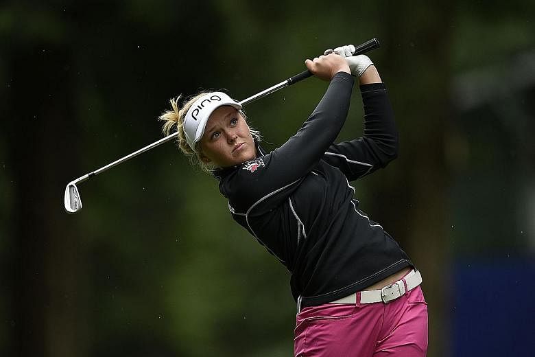 Canada's Brooke Henderson relied on a red-hot putter to card a 67 in the first round of the year's second women's Major.