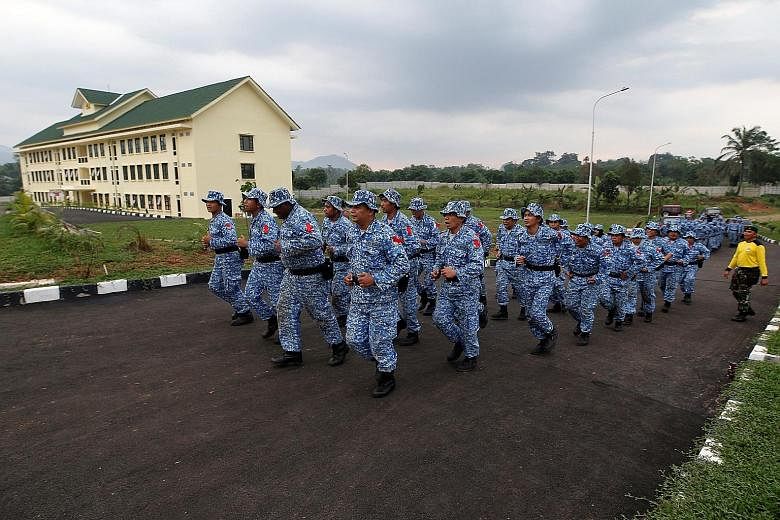 Participants in the Bela Negara, or Defend the Nation, programme jogging at a training centre in Rumpin, Bogor, West Java, earlier this month. A military spokesman has revealed that the programme in Bali will be the first to include the training of s