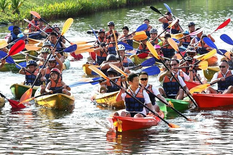 Mr Ong Ye Kung (foreground, centre), who is Acting Minister for Education (Higher Education and Skills) and Senior Minister of State for Defence, participating in the inaugural Safra Punggol Waterway Challenge.