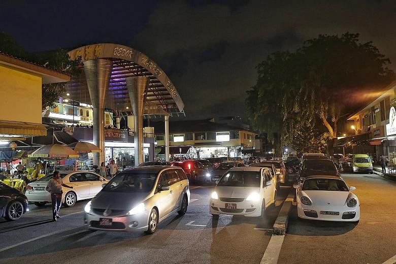 The carpark at Simpang Bedok was full at dinner time last night, with cars circling repeatedly as customers hunted for a parking space.