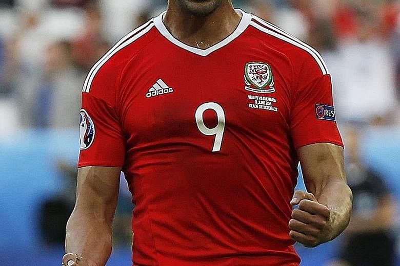 Hal Robson-Kanu celebrating after helping Wales to a 2-1 win over Group B rivals Slovakia.