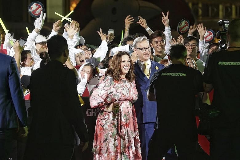 Oscar-nominated comedienne Melissa McCarthy and director Paul Feig (centre) were at the Marina Bay Sands event plaza last night for a red carpet event to celebrate the all-female remake of Ghostbusters. McCarthy plays paranormal expert Abby Yates in 