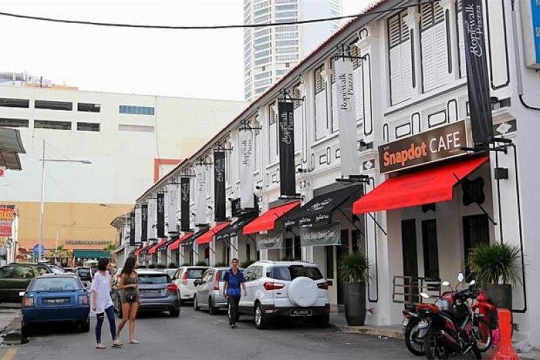 The "Little Singapore" row of restored pre-war shophouses along Jalan Pintal Tali in George Town, Penang.