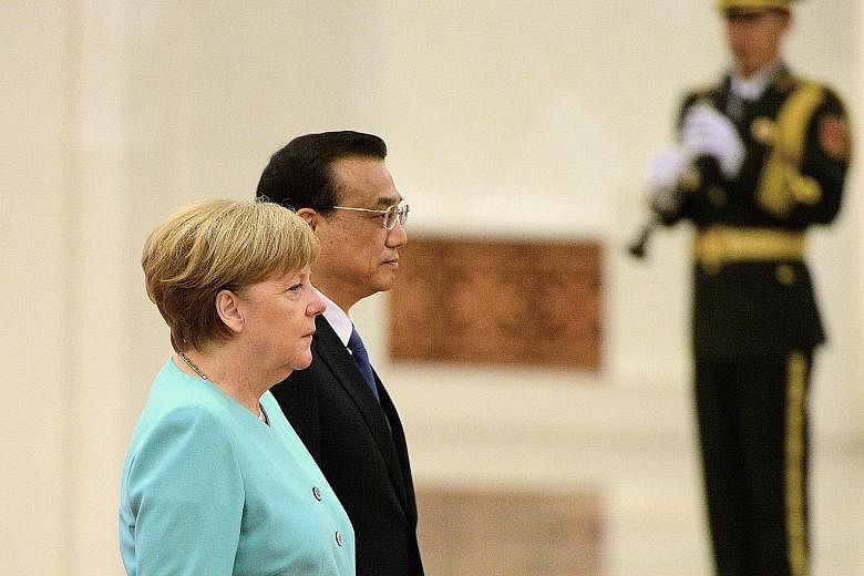 Dr Merkel and Mr Li met at the Great Hall of the People yesterday.