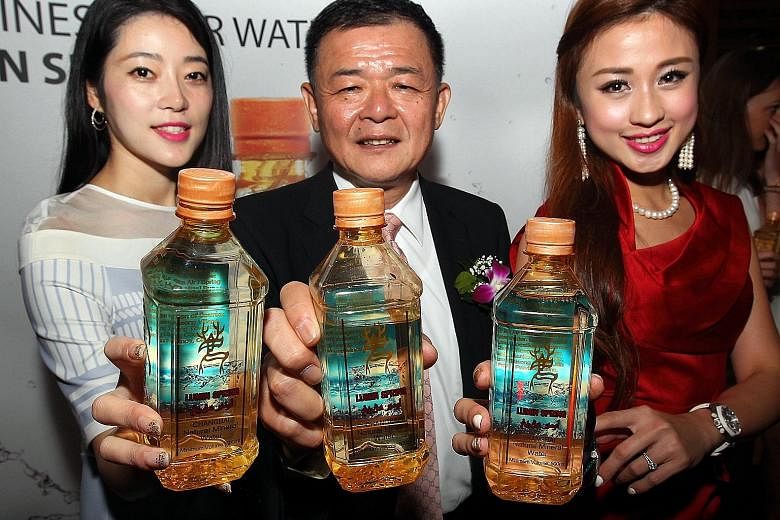 Lumin Spring director Philip Ting showing off his company's bottled mineral water that comes with the Jakim halal logo. He says: "If we tell buyers that our water is Malaysian halal-certified, it sells better." New halal items on the market now inclu