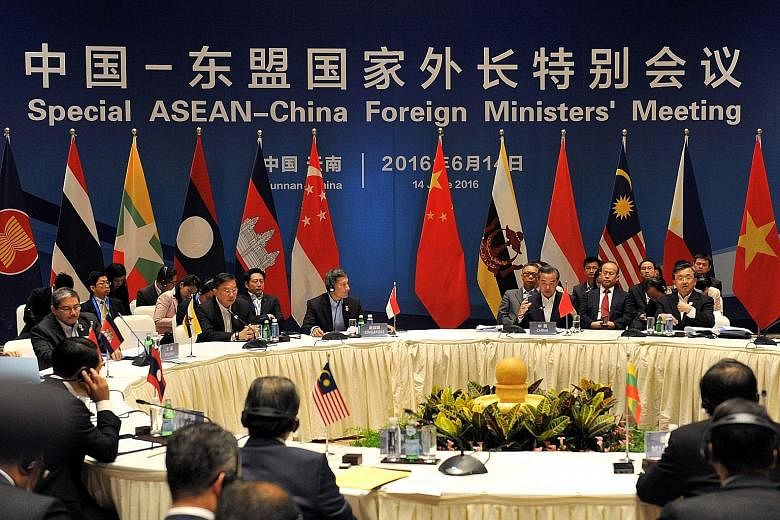 Singapore Foreign Minister Vivian Balakrishnan and Chinese Foreign Minister Wang Yi - the co-chairs at a special Asean-China foreign ministers' meeting - with their counterparts from Asean member nations in south-west China's Yunnan province yesterda