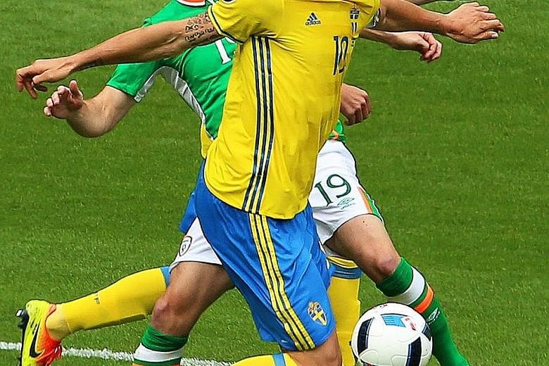 Sweden's Zlatan Ibrahimovic (front) in action against Ireland's Robbie Brady (left). The Paris St Germain hero cut an anonymous figure as his side failed to manage a single shot on target.
