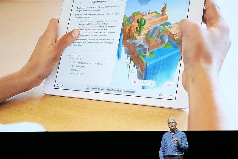 Apple's chief executive Tim Cook announcing Swift Playgrounds at the firm's Worldwide Developer Conference. Users of the app will be asked to write codes for an animated character to perform simple tasks.