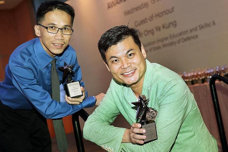 At the Singapore Children's Society's Awards Presentation ceremony yesterday, Mr Tay (left) received the Platinum Service Award, given to those who have served for at least 15 years. Mr Yapp received the Platinum Award, given to those who raise betwe