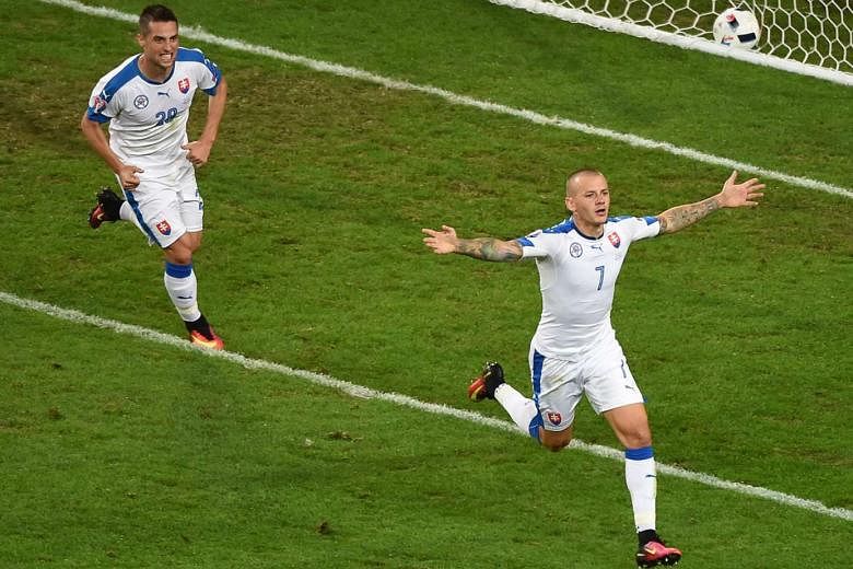 Vladimir Weiss (right) celebrating with Robert Mak after Slovakia scored to take the lead against Russia. His goal preceded Marek Hamsik's strike to give the Slovaks a 2-1 win and revived their hopes of qualifying for the knockout stages after their openi