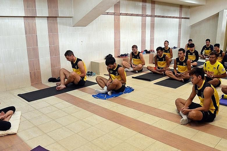 Balestier's new signing Tokic (left-most player) joining his team-mates in a yoga session on Wednesday. He has made an immediate impact, scoring once and notching two assists in two games.