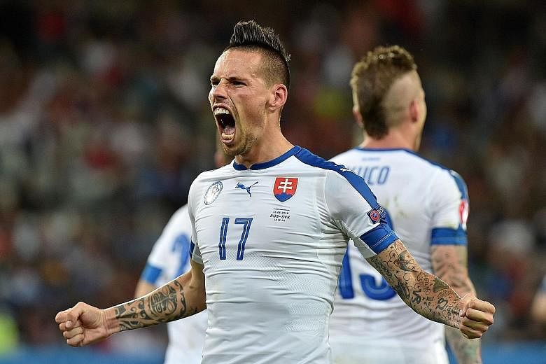 Slovakia midfielder Marek Hamsik celebrating his goal against Russia. His national team coach Jan Kozak has tipped his star man to move on from Serie A side Napoli, who have become "too small for him".