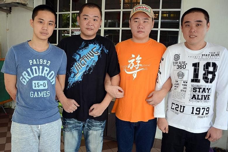 The four men (from left) Mr Johnny Lau, Mr Wong Hung Sing, Mr Wong Teck Chii and Mr Wong Teck Kang in Sarawak after their release. They were kidnapped on April 1 and released on June 7.