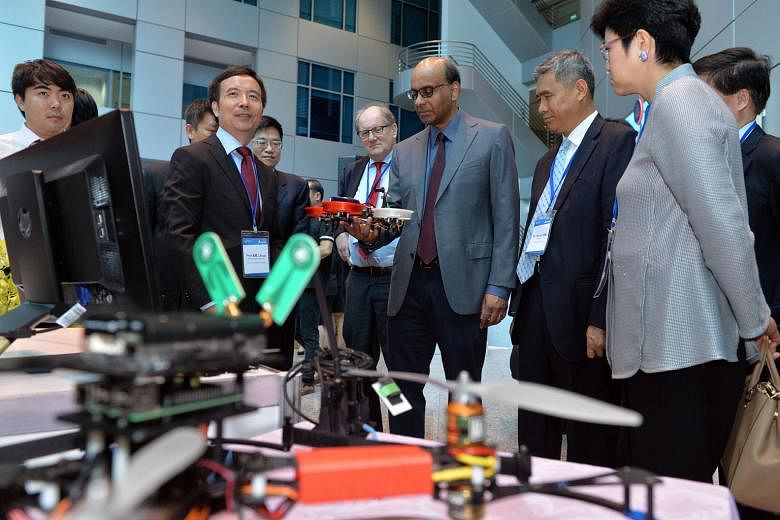Mr Tharman visiting the Delta-NTU Corporate Laboratory for Cyber-Physical Systems yesterday. With him are lab director Xie Lihua (from left), Prof Andersson, Mr Hai and Permanent Secretary (National Research and Development and Public Service Division) Yo