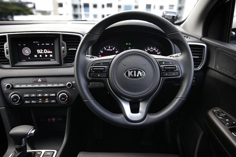The new Kia Sportage has a leather-wrapped multi-function steering wheel.