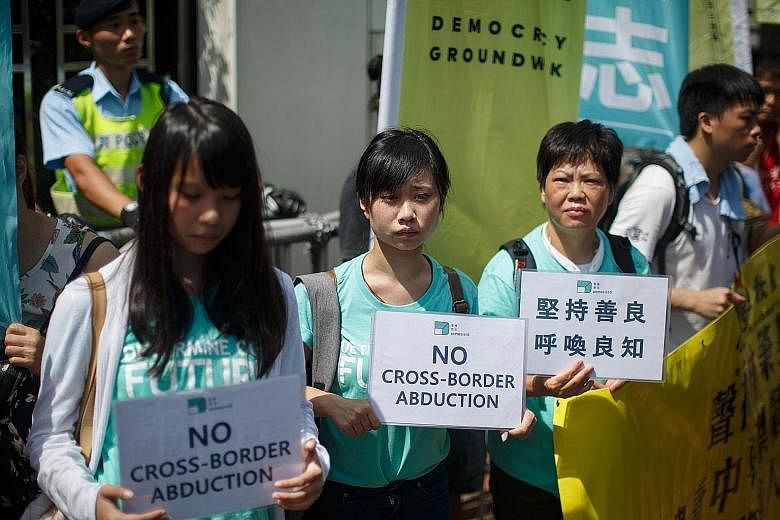 Protesters from pro-democracy group Demosisto outside China's liaison office in Hong Kong yesterday.