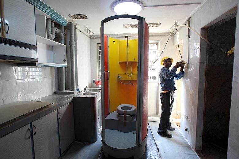 For those having their homes renovated under the Home Improvement Programme, a portable toilet that comes with a heated shower is installed inside the flat at night but dismantled during the day. For those who are renovating on their own, ask your co