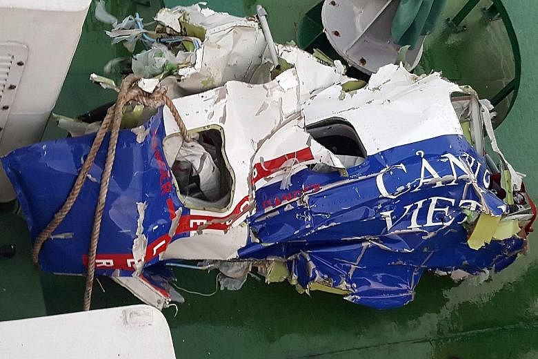 Debris found in the Gulf of Tonkin after Vietnam's coastguard plane crashed in a rescue mission.