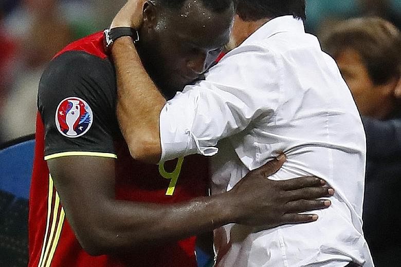 Romelu Lukaku embracing Marc Wilmots after being taken off against Italy. The Everton striker's abject display in their opening group game may prompt his coach to vary his forward selection against the Irish.