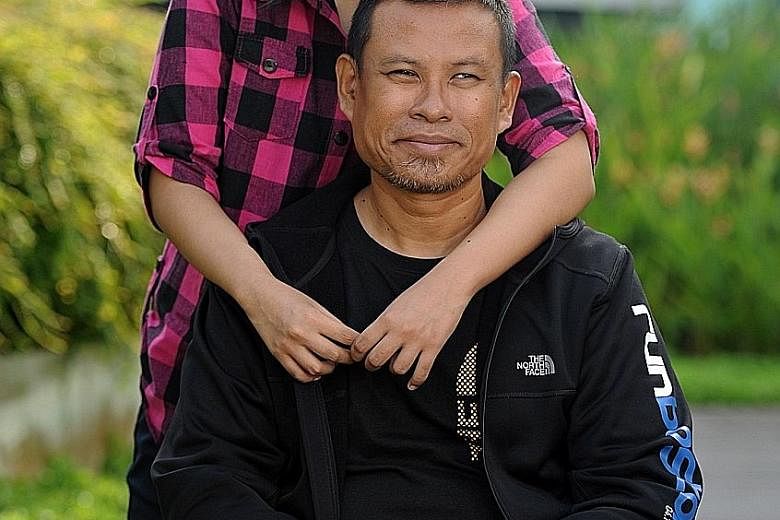 Mr Shariff with his 16-year-old daughter Athirah, who has liver cirrhosis. The 47-year-old, who runs marathons despite having his left limb amputated in 2008 because of a skin infection, calls Athirah his "biggest motivation".